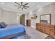 Primary bedroom with wood floors, trey ceiling and flat screen television at 823 Waterton Ave., Myrtle Beach, SC 29579