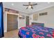 Bedroom features sports decorations, wooden doors, and ceiling fan at 823 Waterton Ave., Myrtle Beach, SC 29579