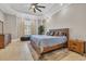 Primary bedroom featuring trey ceilings, ceiling fan and light tile floors at 823 Waterton Ave., Myrtle Beach, SC 29579