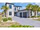 Stunning two-story home featuring a three-car garage, palm trees, and a beautifully stamped concrete driveway at 823 Waterton Ave., Myrtle Beach, SC 29579