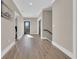 Spacious hallway with wood floors, neutral walls, and ample natural light at 823 Waterton Ave., Myrtle Beach, SC 29579