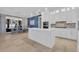 Bright and modern kitchen featuring a center island, stainless appliances, pendant lighting, and an adjacent dining area at 823 Waterton Ave., Myrtle Beach, SC 29579