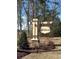 Elegant community entrance sign with the 'Northbrook' name, set amidst manicured landscaping and tall trees at 85 Northbrook Dr, Murrells Inlet, SC 29576