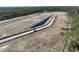 Drone shot displaying the ongoing community construction, highlighting the early stages of development and infrastructure at 85 Northbrook Dr, Murrells Inlet, SC 29576