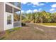 View of the back porch overlooking a tranquil pond and lush trees at 881 Palmetto Trail # 103, Myrtle Beach, SC 29577