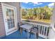 View of pond from back porch seating area with outdoor furniture at 881 Palmetto Trail # 103, Myrtle Beach, SC 29577