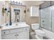 Bathroom featuring a white vanity, toilet, shower and view to the bedroom at 881 Palmetto Trail # 103, Myrtle Beach, SC 29577