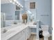 Charming blue bathroom with double vanity, lots of light and decorative vases at 881 Palmetto Trail # 103, Myrtle Beach, SC 29577