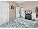 Bedroom showcasing a comfortable bed, closet, and view to the hallway at 881 Palmetto Trail # 103, Myrtle Beach, SC 29577