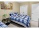 Bedroom showcasing two beds, neutral walls, and a painting at 881 Palmetto Trail # 103, Myrtle Beach, SC 29577