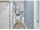 Hallway featuring modern wood-look flooring, doors and an access to the kitchen at 881 Palmetto Trail # 103, Myrtle Beach, SC 29577
