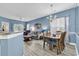 Inviting open-concept features dining area, living room with sofa, and breakfast bar at 881 Palmetto Trail # 103, Myrtle Beach, SC 29577