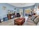 Open living room with a fireplace, ceiling fan, and sliding glass doors to the patio at 881 Palmetto Trail # 103, Myrtle Beach, SC 29577