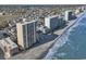 An aerial view highlights the high-rise condos on the beach, offering beachfront living and ocean views at 912 N Waccamaw Dr. # 1404, Garden City Beach, SC 29576