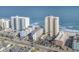An aerial view shows multiple beachside condo properties, some with pools and beach access at 912 N Waccamaw Dr. # 1404, Garden City Beach, SC 29576