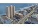 An aerial view shows the condos and buildings lining the beach with an ocean view from each property at 912 N Waccamaw Dr. # 1404, Garden City Beach, SC 29576