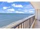 Wide angle of balcony overlooking the ocean waters and sandy shore at 912 N Waccamaw Dr. # 1404, Garden City Beach, SC 29576