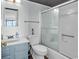 Well-lit bathroom featuring a shower with glass doors, toilet, and a stylish vanity with ample counter space at 912 N Waccamaw Dr. # 1404, Garden City Beach, SC 29576