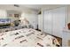 Comfortable bedroom featuring a dresser with decor, closet, and hardwood floors at 912 N Waccamaw Dr. # 1404, Garden City Beach, SC 29576