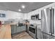 Modern kitchen featuring stainless steel appliances and wood countertops at 912 N Waccamaw Dr. # 1404, Garden City Beach, SC 29576