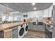 Updated kitchen with stainless steel appliances and washer/dryer combo at 912 N Waccamaw Dr. # 1404, Garden City Beach, SC 29576