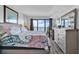 Comfortable main bedroom featuring a king-size bed, dresser, and a balcony with scenic views at 912 N Waccamaw Dr. # 1404, Garden City Beach, SC 29576