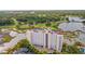 Stunning aerial view of the high-rise residential building surrounded by lush golf course and marsh views at 9547 Edgerton Dr. # 301, Myrtle Beach, SC 29572