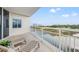 A balcony with two lounge chairs overlooking a waterway at 9547 Edgerton Dr. # 301, Myrtle Beach, SC 29572