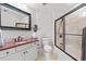 Bathroom featuring granite countertops, a toilet, a full mirror, and a glass-doored shower at 9547 Edgerton Dr. # 301, Myrtle Beach, SC 29572