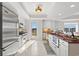 Well-lit kitchen features modern stainless-steel appliances, countertops, and ample cabinet space at 9547 Edgerton Dr. # 301, Myrtle Beach, SC 29572