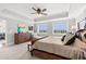 A spacious main bedroom with furniture, TV, and a view of the waterway at 9547 Edgerton Dr. # 301, Myrtle Beach, SC 29572