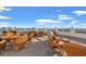 Inviting rooftop terrace with comfortable seating and stunning ocean views at 9547 Edgerton Dr. # 301, Myrtle Beach, SC 29572