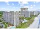 High-rise condo complex on the beach, with multiple pools and landscaping at 9820 Queensway Blvd. # 303, Myrtle Beach, SC 29572