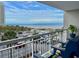 Balcony with an ocean view and seating overlooking the beach, ocean, and parking area at 9820 Queensway Blvd. # 303, Myrtle Beach, SC 29572