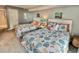 Bright bedroom features two beds with beach-themed decor and matching linens at 9820 Queensway Blvd. # 303, Myrtle Beach, SC 29572