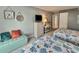 Bedroom with twin beds, a dresser with a tv, coastal décor, and comfortable seating for relaxation at 9820 Queensway Blvd. # 303, Myrtle Beach, SC 29572