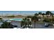 Overhead view features a community pool, palm trees, parking, and a picturesque sandy beach in the background at 9820 Queensway Blvd. # 303, Myrtle Beach, SC 29572