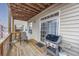 Outdoor back porch features a grill and sliding glass doors at 102-A N Poplar Dr., Surfside Beach, SC 29575