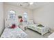 Charming bedroom with two twin beds, beach-themed decor, and natural light from the arched windows at 102-A N Poplar Dr., Surfside Beach, SC 29575