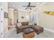 Relaxing living room with a sectional sofa, and stairs to other floors visible at 102-A N Poplar Dr., Surfside Beach, SC 29575