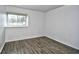 Bedroom with wood flooring and window at 10301 N Kings Hwy. # 15-8, Myrtle Beach, SC 29572
