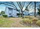 Exterior view of the complex with trees and lush landscaping at 10301 N Kings Hwy. # 15-8, Myrtle Beach, SC 29572