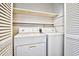 Laundry room with a washer, a dryer, and shelves at 10301 N Kings Hwy. # 15-8, Myrtle Beach, SC 29572