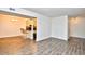 Open floorplan featuring wood-look flooring leading to the bar and kitchen area at 10301 N Kings Hwy. # 15-8, Myrtle Beach, SC 29572