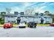 Exterior of the townhome featuring ample parking with a red and black truck at 10301 N Kings Hwy. # 15-8, Myrtle Beach, SC 29572