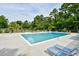 Refreshing community pool with lounge chairs and surrounding greenery at 10301 N Kings Hwy. # 15-8, Myrtle Beach, SC 29572