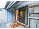 Porch with blue door, shelves, and slider door at 10301 N Kings Hwy. # 15-8, Myrtle Beach, SC 29572