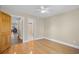 Cozy bedroom features beautiful hardwood floors and ample natural light at 1043 Yellow Jasmine Dr., Longs, SC 29568