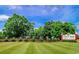 The Long Bay Club entrance features lush greenery and a brick wall at 1043 Yellow Jasmine Dr., Longs, SC 29568