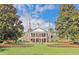 Clubhouse with American flag and manicured lawn at 1043 Yellow Jasmine Dr., Longs, SC 29568
